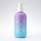 PixieYou Shampoo in a purple ombre bottle with a pump, featuring ingredients like watermelon, strawberry, and green tea extra