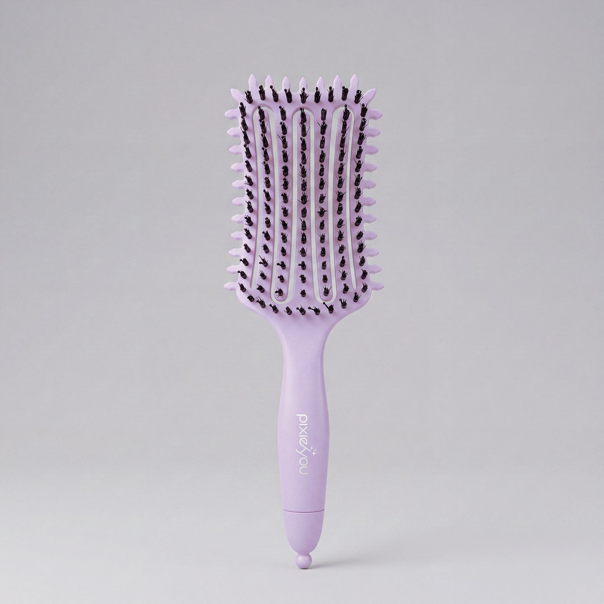 PixieYou Cloud Brush in lavender with flexible bristles and a comfortable grip for detangling hair.