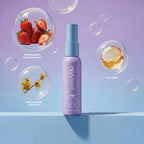 PixieYou Magic Wand in a lavender bottle with strawberry, glycerin, and witch hazel extracts displayed in bubbles.