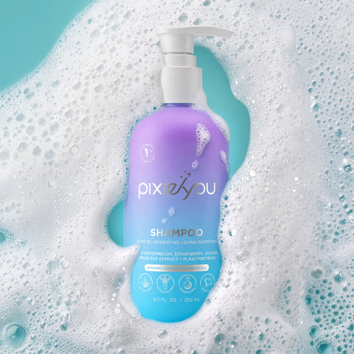 PixieYou Shampoo bottle with a pump, featuring a gradient design, surrounded by bubbles on a teal background. 250 ml.