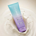 PixieYou Style & Define Leave-in Cream in a pastel tube, surrounded by a splash of creamy liquid. 8.5 fl oz.