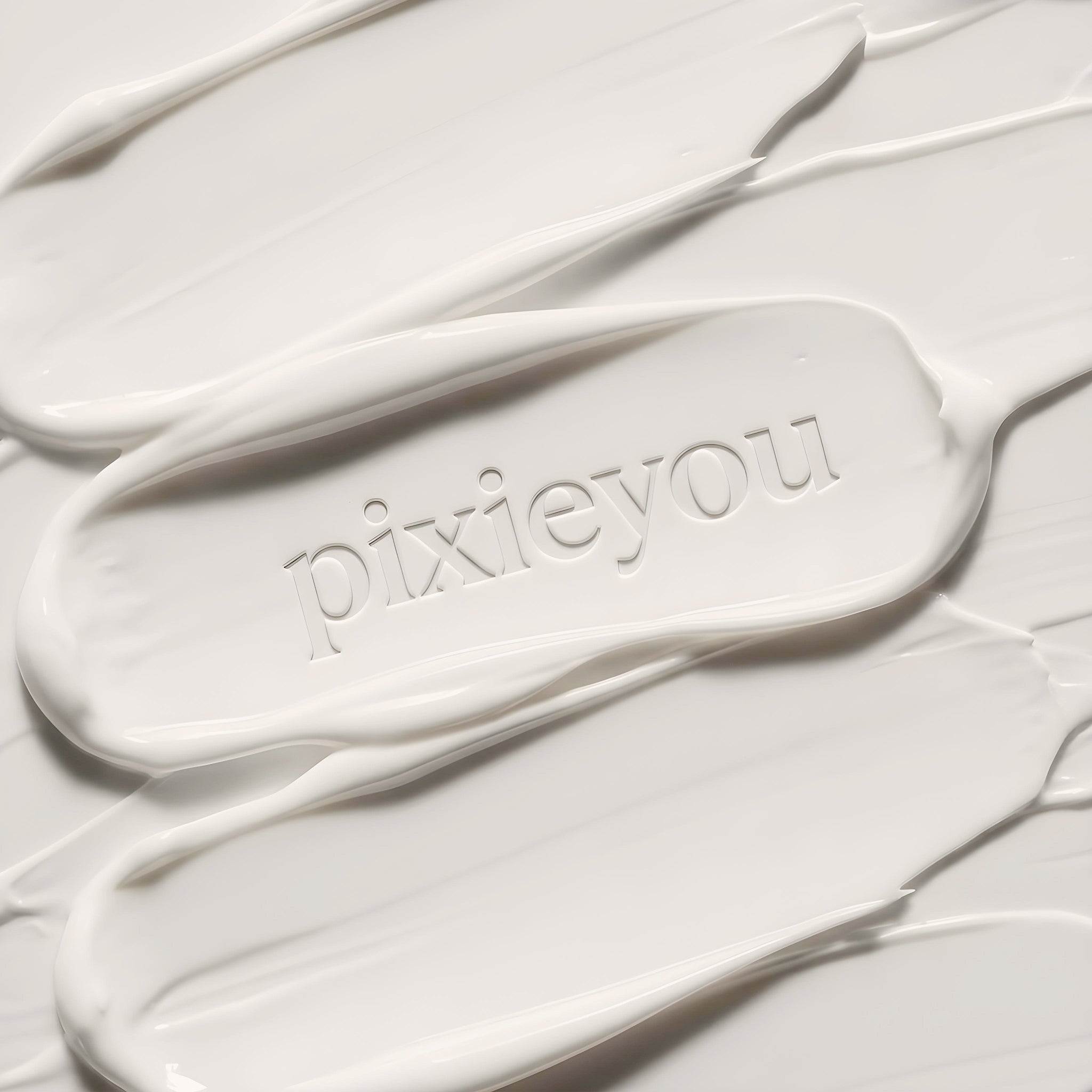 PixieYou Leave-in product displayed on a smooth, creamy white background with the brand name embossed.