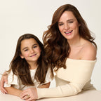 Mother and daughter smiling together, showcasing healthy, styled hair, with the PixieYou Magic Wand nearby.